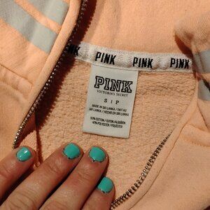 Pink brand pullover sweatshirt.